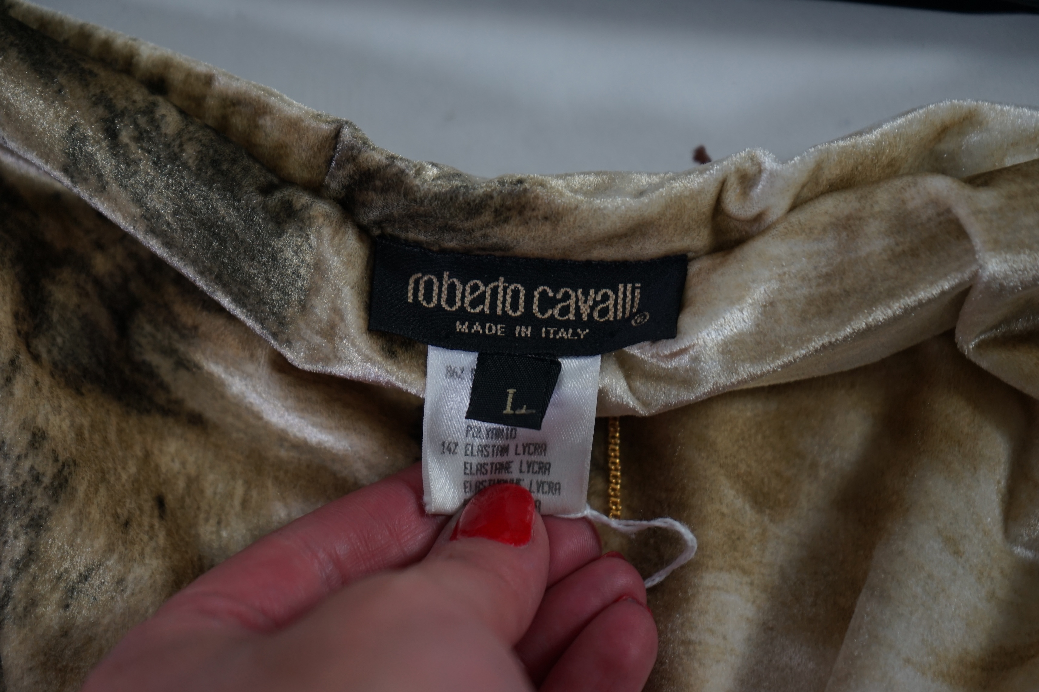 A Roberto Cavalli skirt with matching v neck sweater. Size 14-16 Proceeds to Happy Paws Puppy Rescue